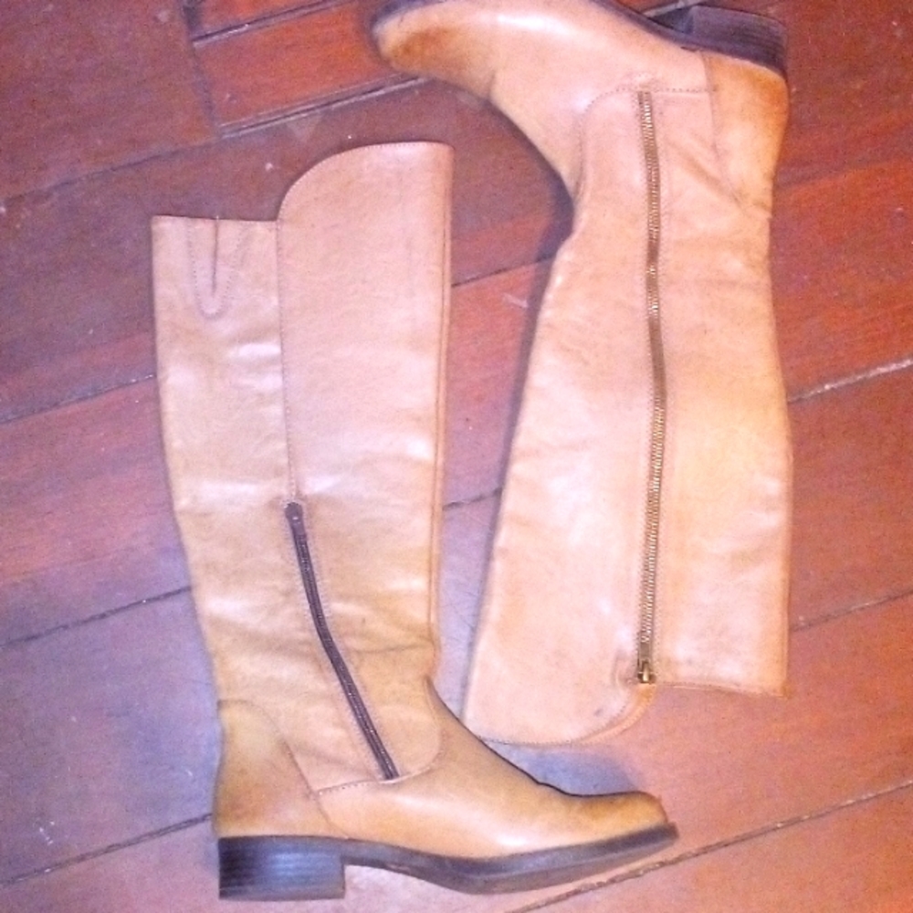 Right below  knee boots made by Mia Colton made in China with man-made material